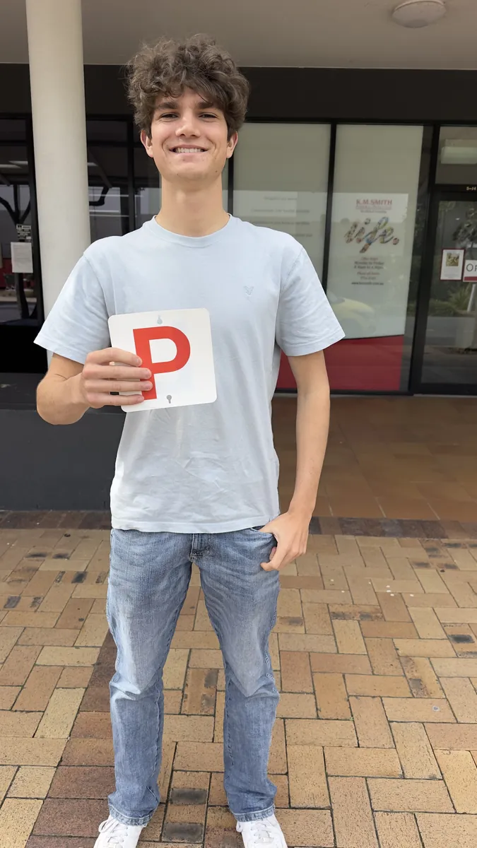 Lawson holding his P plate after passing first go in a manual