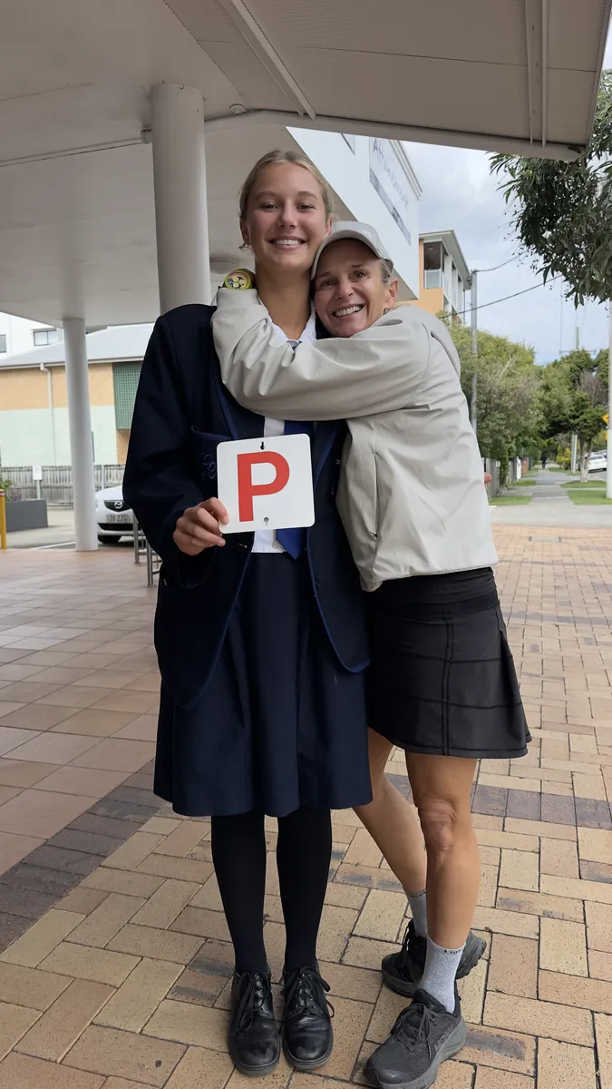 Penny celebrating her pass with her mum